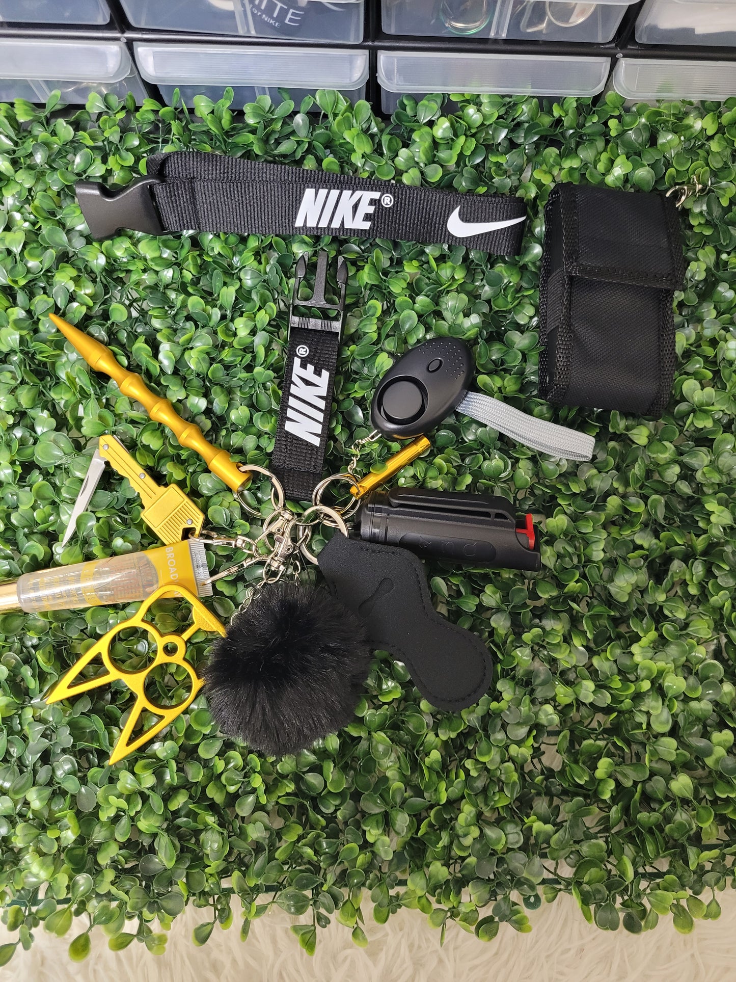 Gold and Black Nike keychain with taser